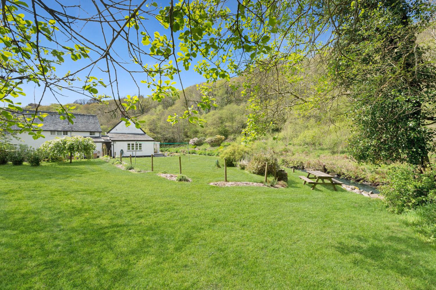 Bratton Mill Cottage garden is up to the post and rope fence