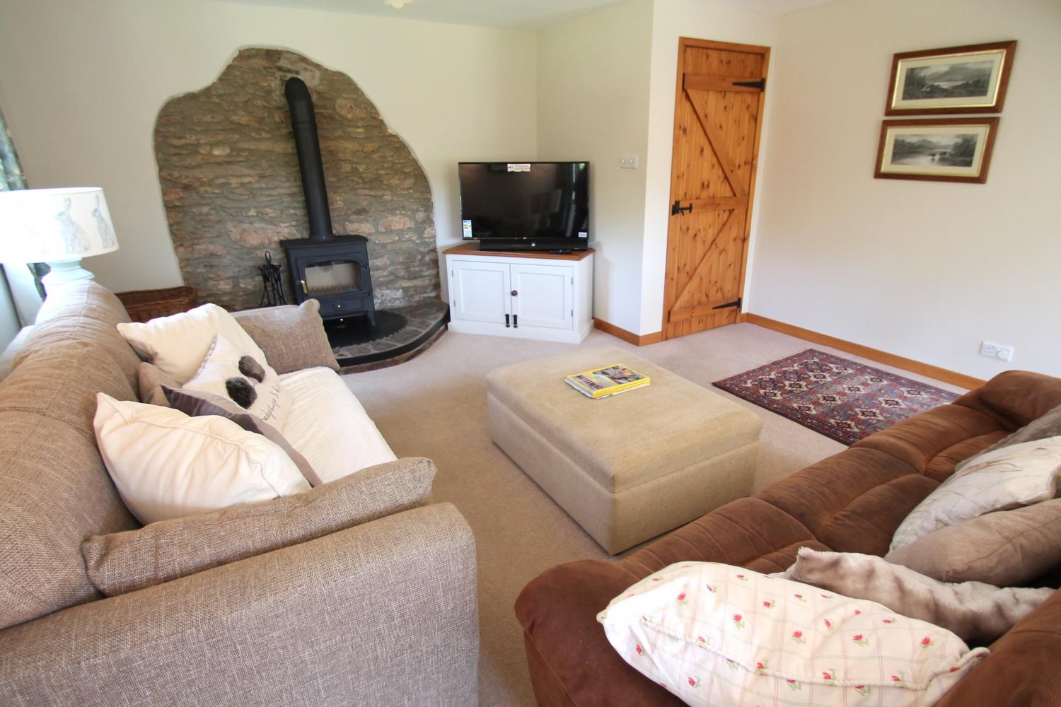 Middle Stolford living room with log burner